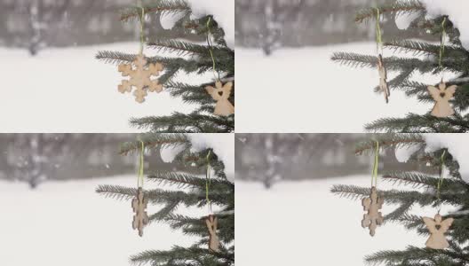冬天，美丽的雪花形状的木制玩具挂在圣诞树上高清在线视频素材下载