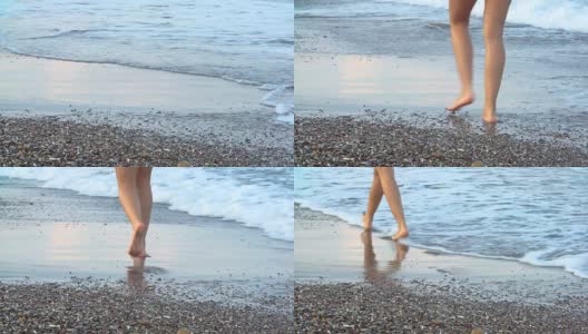 女人美丽的晒黑的腿走在沙滩上。走在海上的女孩高清在线视频素材下载