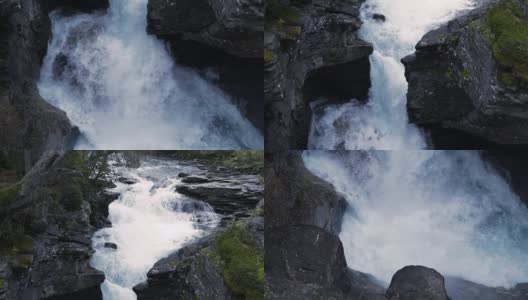 HD慢动作瀑布在挪威与岩石和森林，Pan Up高清在线视频素材下载