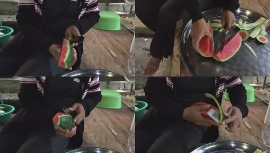 近距离拍摄的女人的手用菜刀切成熟的西瓜新鲜水果高清在线视频素材下载