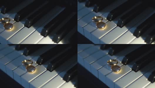 3 .结婚戒指放在钢琴琴键上高清在线视频素材下载