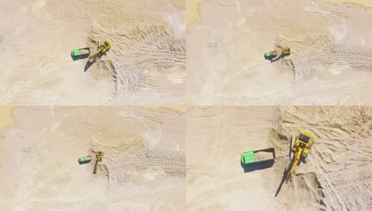 无人驾驶飞机在露天矿山的挖掘机上飞行。高清在线视频素材下载