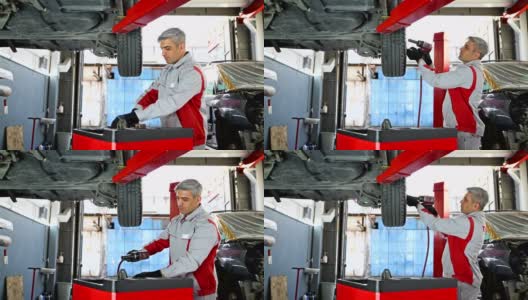 汽车拆卸轮胎-车辆部分在汽车修理厂- 4K分辨率高清在线视频素材下载