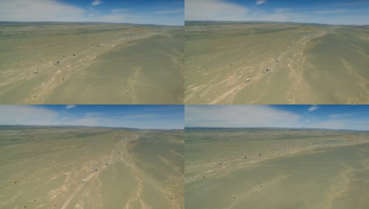 汽车在戈壁沙漠行驶的鸟瞰图，新疆，中国。高清在线视频素材下载