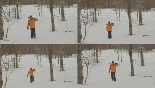 慢动作，手动查看雪上的滑雪步行者向滑雪场的方向高清在线视频素材下载