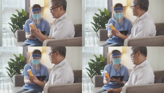 健康访视员和一名老年男子在家访期间，护士医生向他的老年男性病人解释药物高清在线视频素材下载