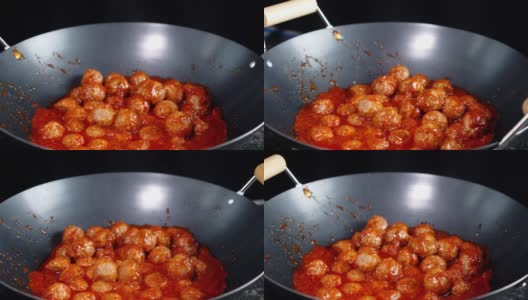 Cooking meatballs in a frying pan. A slow rotation.高清在线视频素材下载