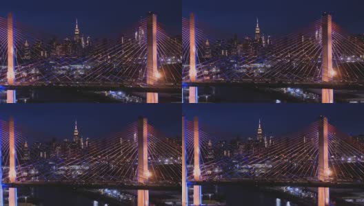 在科修斯科大桥上，曼哈顿中城的夜景。航拍视频与向后相机运动。高清在线视频素材下载