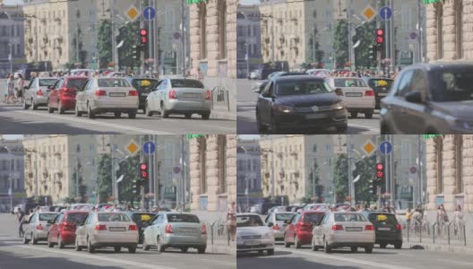 汽车停在十字路口，等待红绿灯。繁忙的十字路口高清在线视频素材下载