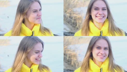 一个年轻、快乐、微笑、害羞的蓝眼睛的女人在大自然中，穿着黄色的夹克，在一个春秋季阳光明媚的日子。人生的乐趣，积极的态度。慢镜头,4 k高清在线视频素材下载