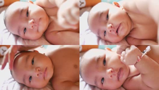 亚洲宝宝洗澡后的盛装打扮高清在线视频素材下载