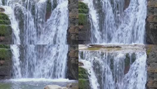 令人惊叹的风景，美丽的山河瀑布与白色泡沫水从岩石悬崖下降在夏季雨林高清在线视频素材下载
