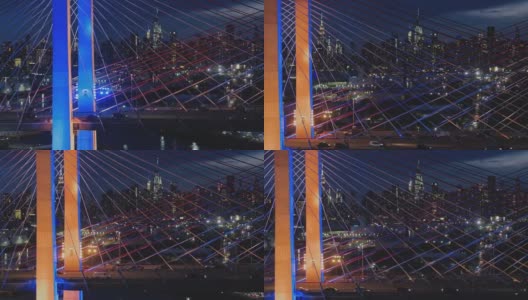 在科修斯科大桥上，曼哈顿中城的夜景。航拍视频与平移和上升的摄像机运动。高清在线视频素材下载