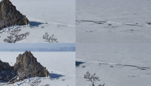 汽车沿着结冰的贝加尔湖行驶，离沙曼卡山不远。高清在线视频素材下载
