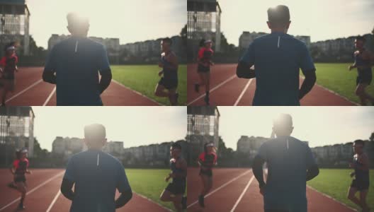 晨跑前，亚洲中国运动队队长在田径场指导球队热身高清在线视频素材下载