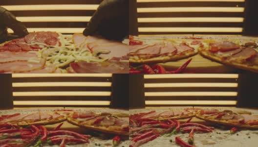 手拿起一块披萨。美味的披萨被切成块的特写镜头。美味的烤披萨配火腿、融化的芝士、红辣椒。ARRI ALEXA用老瓦镜头拍摄。相机移动高清在线视频素材下载