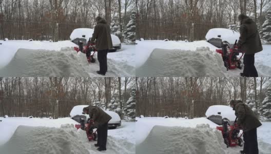 一场冬季暴风雪过后，一名男子正在清理他被雪覆盖的汽车周围的车道。他正在启动除雪机。高清在线视频素材下载