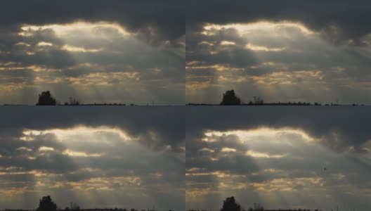 飞机螺旋桨轮廓的慢动作飞行与多云的天空在日落高清在线视频素材下载