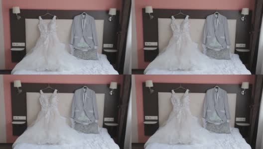 漂亮时尚的婚纱和礼服放在床上高清在线视频素材下载