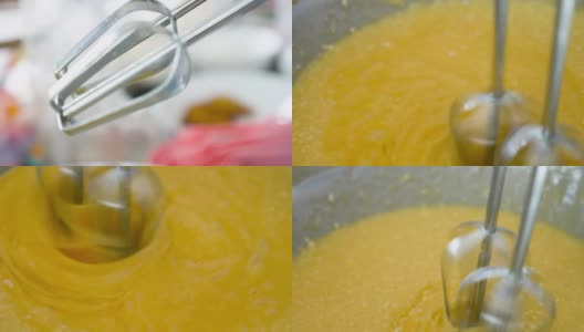 近距离观察搅拌机搅拌美味奶油制作蛋糕的过程。高清在线视频素材下载