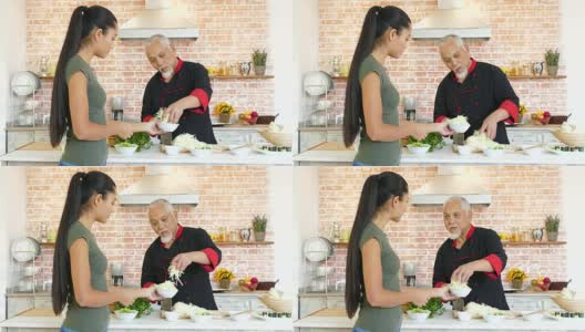 亚洲厨师和助理制作新鲜沙拉高清在线视频素材下载