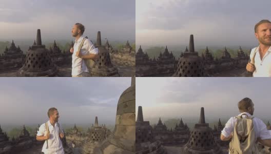 印尼婆罗浮屠寺，一名男子凝视日出的慢动作视频。人们旅行冒险的概念高清在线视频素材下载
