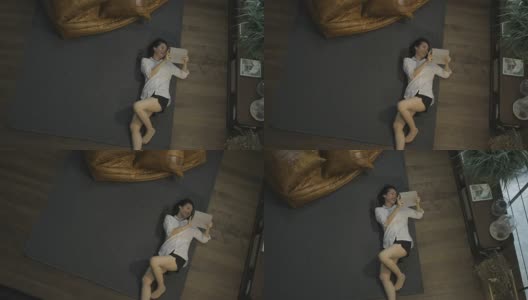 躺着用平板电脑的亚洲女人高清在线视频素材下载