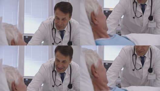 成熟的医生在病房里与病人交谈高清在线视频素材下载