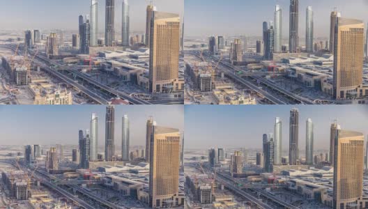 日落时分的迪拜市中心天际线和阿联酋购物中心附近的道路交通高清在线视频素材下载