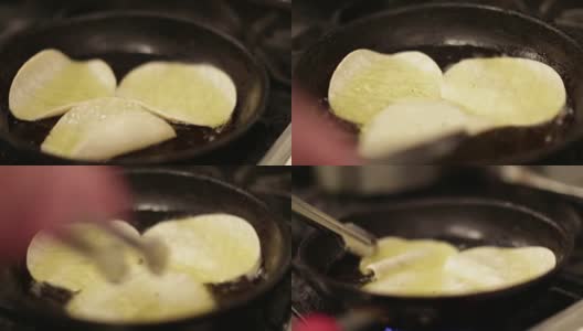 用铁煎锅煎玉米饼高清在线视频素材下载