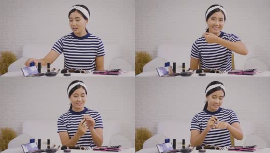 年轻的亚洲美容博主介绍化妆品和记录她的化妆教程视频到社交网络在家通过互联网高清在线视频素材下载