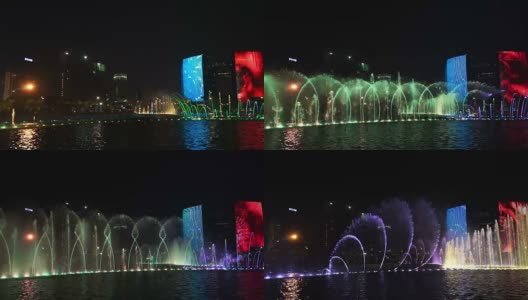 音乐喷泉，色彩斑斓的灯光和现代化的建筑高清在线视频素材下载