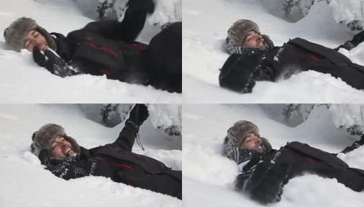 一个滑稽的人把自己扔在雪地里高清在线视频素材下载