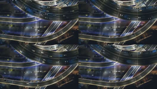 无人机视角的天桥和城市交通在夜间高清在线视频素材下载