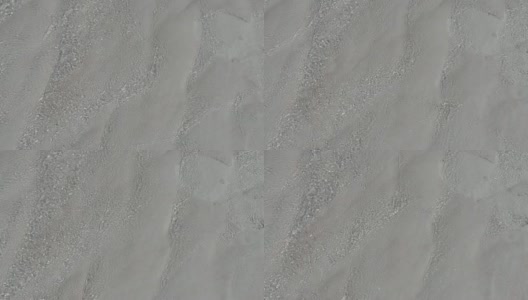 棉花堡,土耳其。女人走在白色石灰质岩石上流动的矿物和水。高清在线视频素材下载
