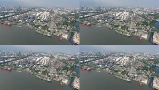 无人机飞行，鸟瞰图美丽的炼油厂与河流反射，高清在线视频素材下载