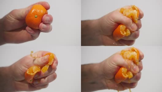 男性手挤鲜橙汁。用手挤橘子高清在线视频素材下载