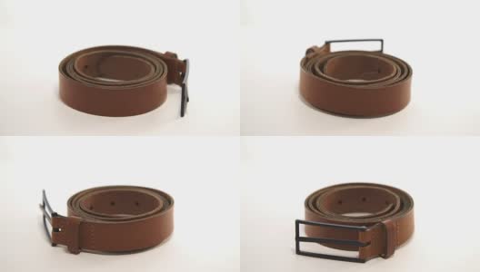 时髦的皮带与扣旋转在白色的背景高清在线视频素材下载