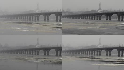 冬天的佩顿桥。基辅第聂伯河附近降雪。间隔拍摄高清在线视频素材下载