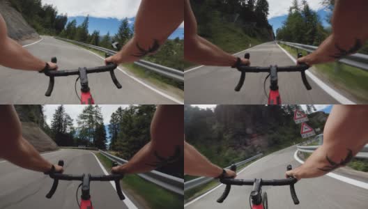 在Dolomites森林的道路上骑自行车竞速的观点高清在线视频素材下载