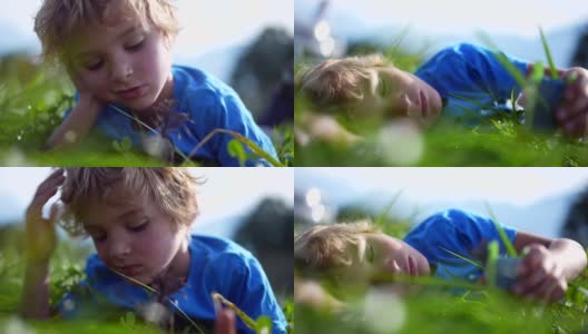 孩子躺在外面的草地上做着白日梦玩耍高清在线视频素材下载
