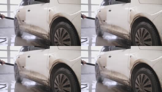 洗车。用泡沫洗车。洗车店的白色汽车。高清在线视频素材下载