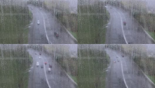 透过湿漉漉的窗户看马路上有雨滴，在雨中有人们的倒影高清在线视频素材下载