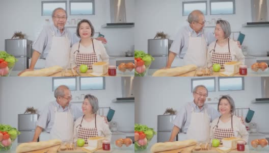 夫妇老亚洲长者幸福生活在家庭厨房。爷爷抱着奶奶幸福地笑着一起享受退休生活。老年人的家庭关系和活动概念。高清在线视频素材下载