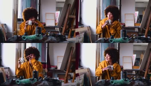 女艺术家正在喝咖啡休息高清在线视频素材下载