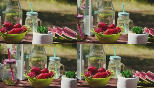 野餐桌上有多汁的水果和美味的柠檬水高清在线视频素材下载
