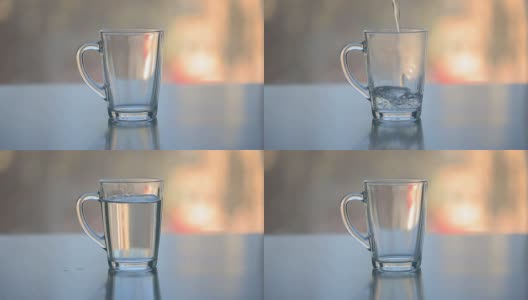 用透明玻璃杯将热水倒在茶上高清在线视频素材下载