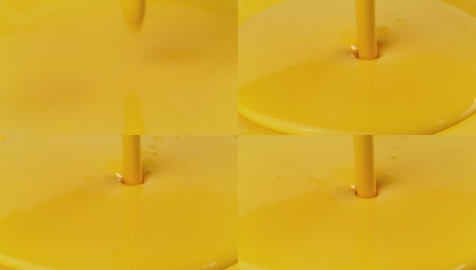 黄色油漆倒在黄色的表面上高清在线视频素材下载