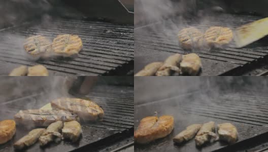 厨师在烤架上烹饪肉和鱼高清在线视频素材下载