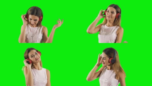 快乐的女孩戴着耳机在绿色的背景下听音乐跳舞高清在线视频素材下载